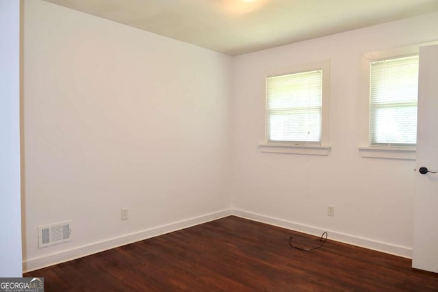 579 Kenridge Cir, Stone Mountain, GA 30083 - empty room featuring baseboards and dark wood-style flooring