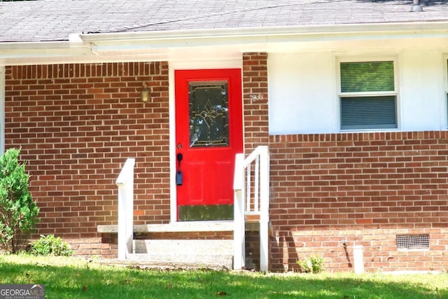 579 Kenridge Cir, Stone Mountain, GA 30083 - entrance to property featuring a shingled roof and brick siding