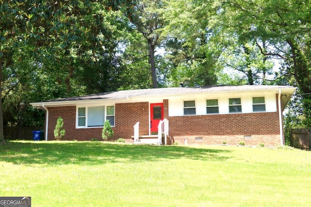 579 Kenridge Cir, Stone Mountain, GA 30083 - single story home with crawl space, brick siding, and a front lawn