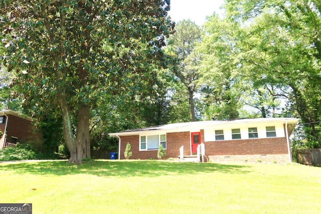 579 Kenridge Cir, Stone Mountain, GA 30083 - single story home with brick siding, a front yard, and crawl space