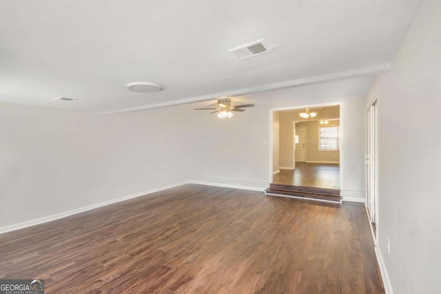 1602 Sycamore Dr NW, Kennesaw, GA 30152 - spare room featuring dark wood-style floors, ceiling fan, and baseboards
