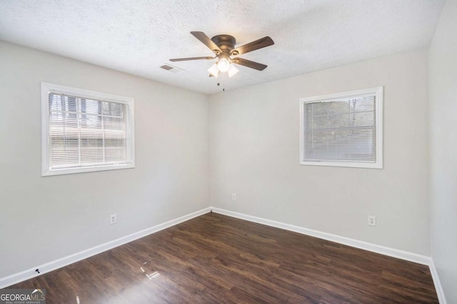 1602 Sycamore Dr NW, Kennesaw, GA 30152 - unfurnished room with wood finished floors, baseboards, a ceiling fan, and a textured ceiling