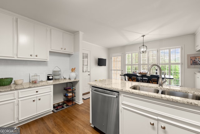 kitchen featuring stainless steel dishwasher, a sink, and white cabinets
