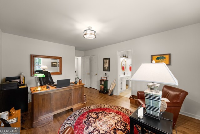 office with wood finished floors and baseboards