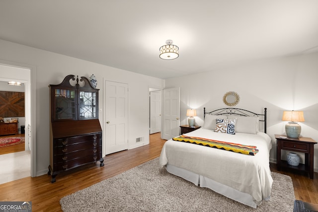 bedroom featuring wood finished floors