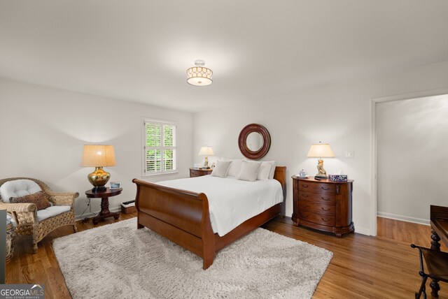 bedroom with wood finished floors
