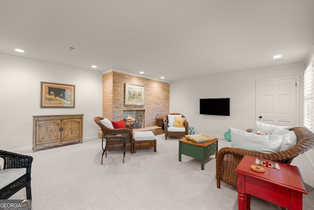 living area featuring recessed lighting, light colored carpet, ornamental molding, a fireplace, and baseboards