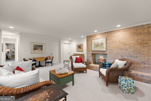 living area with light carpet, recessed lighting, a fireplace, crown molding, and brick wall