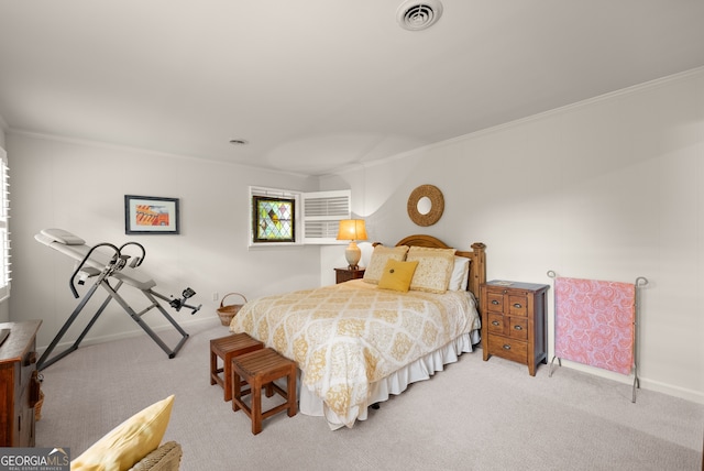 carpeted bedroom featuring crown molding and baseboards