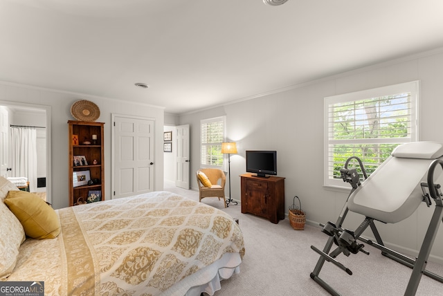 bedroom featuring crown molding, carpet floors, and baseboards