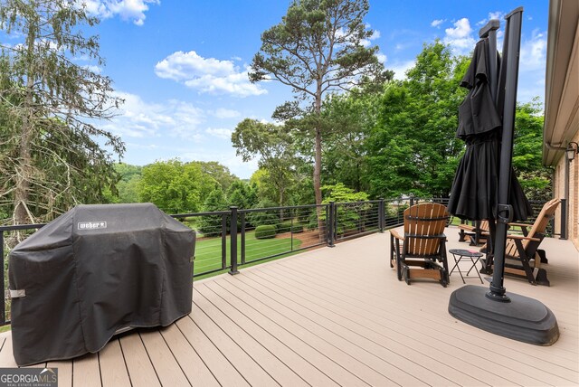 wooden terrace with area for grilling