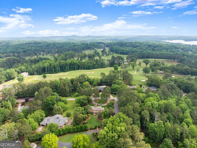 aerial view of a heavily wooded area and a local golf course