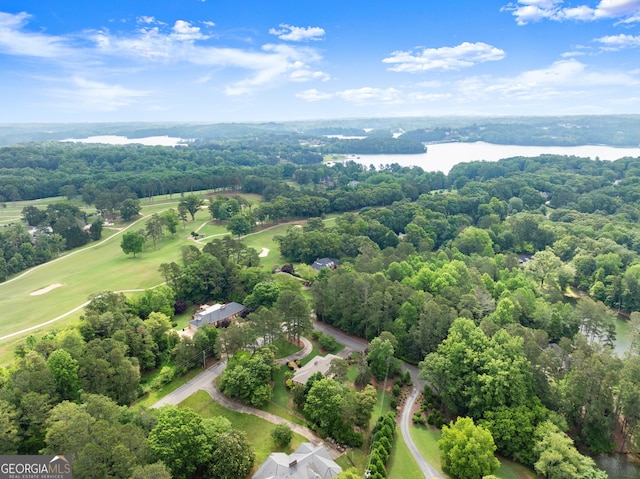 drone / aerial view of a nearby body of water and a golf club