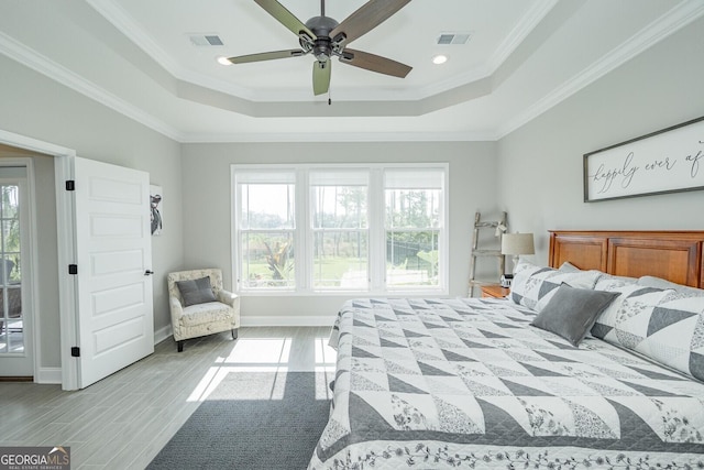 133 Ryan Nicholas Dr, Kingsland, GA 31548 - bedroom featuring a raised ceiling, ornamental molding, light wood-style flooring, baseboards, and ceiling fan