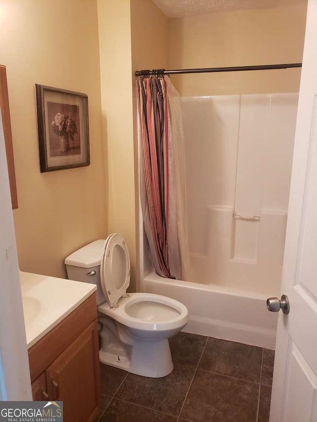 1383 Sims Rd SE, Winder, GA 30680 - bathroom featuring vanity, tile patterned flooring, shower / bath combo with shower curtain, and toilet