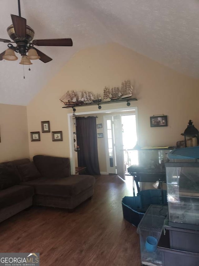 1383 Sims Rd SE, Winder, GA 30680 - living room with vaulted ceiling, a ceiling fan, wood finished floors, and a textured ceiling