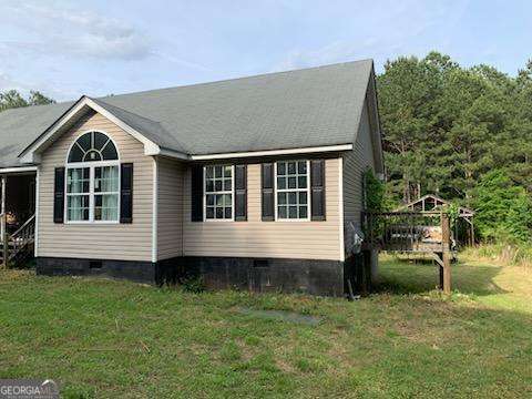 1383 Sims Rd SE, Winder, GA 30680 - view of property exterior featuring crawl space and a lawn