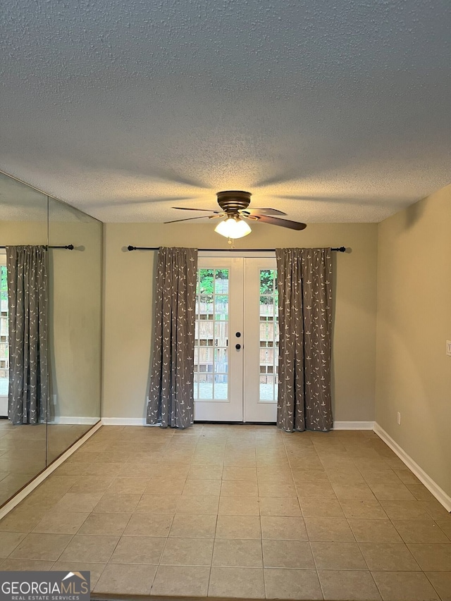 4701 Flat Shoals Rd Unit 41-F, Union City, GA 30291 - tiled spare room featuring a ceiling fan, baseboards, a textured ceiling, and french doors