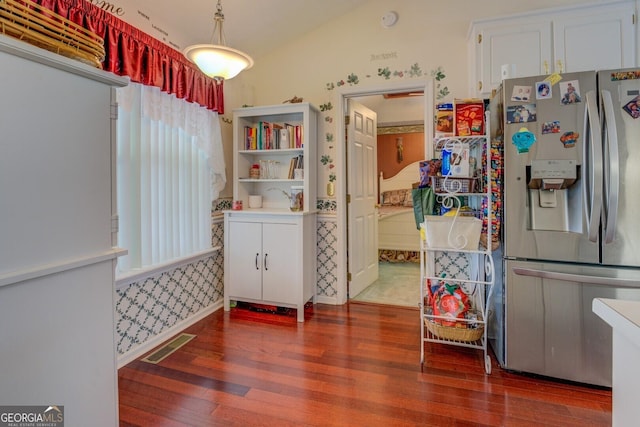 3870 Michaels Creek Ct, Loganville, GA 30052 - kitchen with stainless steel refrigerator with ice dispenser, wood finished floors, healthy amount of natural light, white cabinetry, and wallpapered walls