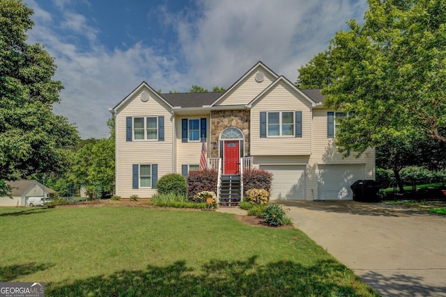 3870 Michaels Creek Ct, Loganville, GA 30052 - bi-level home featuring a garage, concrete driveway, a front yard, and stone siding