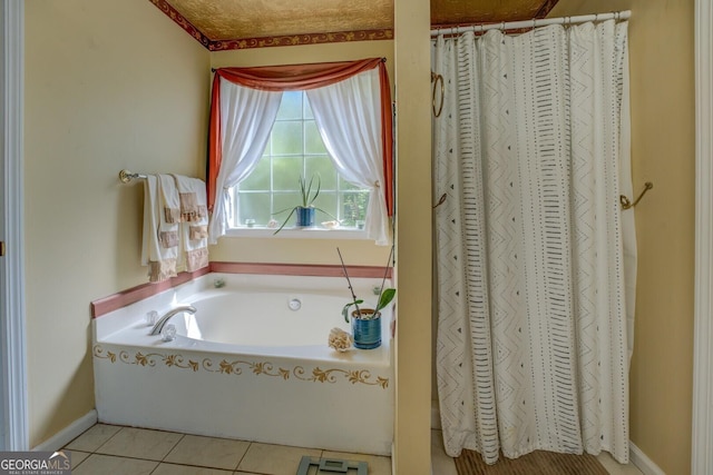 3870 Michaels Creek Ct, Loganville, GA 30052 - full bathroom featuring a garden tub, tile patterned floors, baseboards, and curtained shower