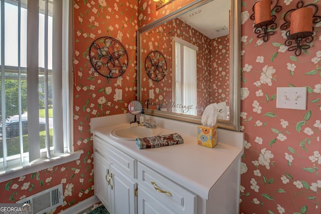 3870 Michaels Creek Ct, Loganville, GA 30052 - bathroom with wallpapered walls and vanity
