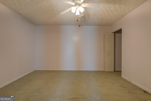 3870 Michaels Creek Ct, Loganville, GA 30052 - spare room with light carpet, a ceiling fan, a textured ceiling, and baseboards