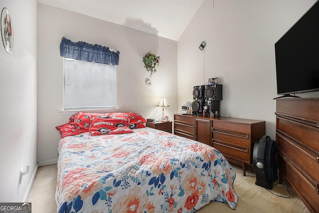 643 Lora Smith Rd, Newnan, GA 30265 - bedroom featuring light carpet and vaulted ceiling