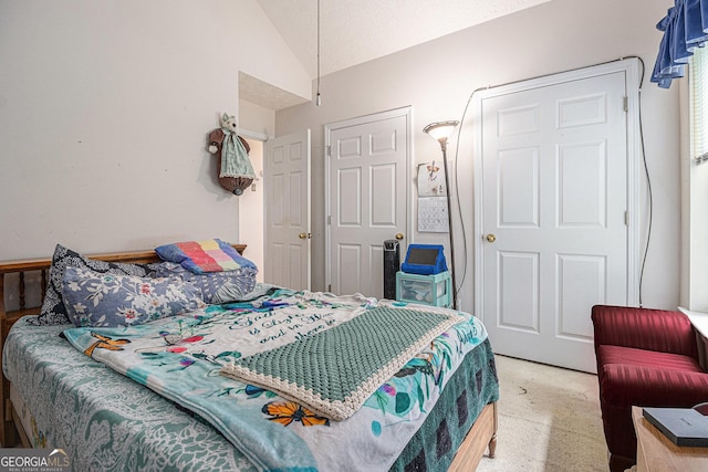 643 Lora Smith Rd, Newnan, GA 30265 - bedroom with lofted ceiling and light colored carpet