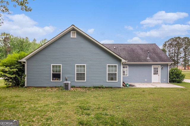 643 Lora Smith Rd, Newnan, GA 30265 - back of house featuring a patio, a lawn, central AC unit, and roof with shingles