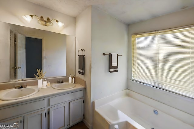 full bathroom featuring a bath and double vanity