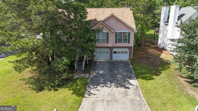 view of front of property with concrete driveway, an attached garage, stairs, brick siding, and a front yard
