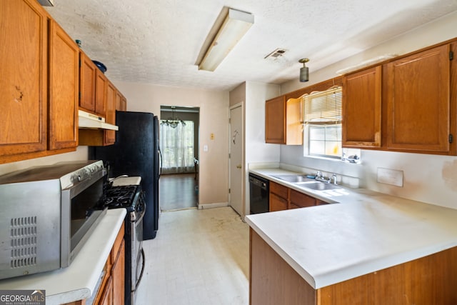 kitchen featuring appliances with stainless steel finishes, light floors, brown cabinetry, under cabinet range hood, and light countertops