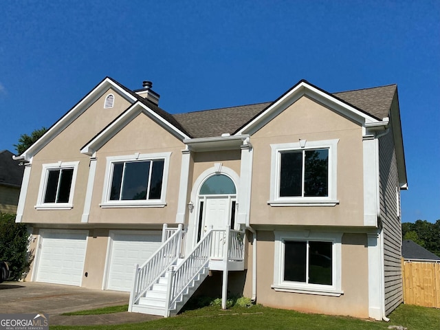 102 Peaceful Vw, Acworth, GA 30102 - split foyer home with stucco siding, an attached garage, and a chimney