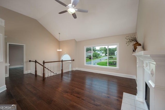 102 Peaceful Vw, Acworth, GA 30102 - unfurnished living room with a tiled fireplace, lofted ceiling, ceiling fan, and wood finished floors