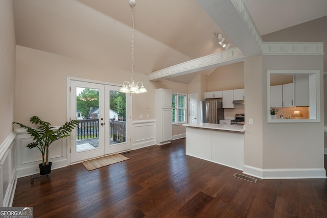 102 Peaceful Vw, Acworth, GA 30102 - kitchen with stainless steel appliances, dark wood-type flooring, a chandelier, a decorative wall, and a wainscoted wall