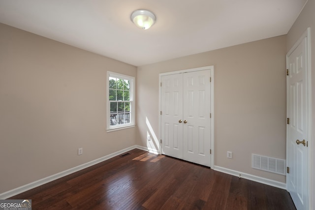 102 Peaceful Vw, Acworth, GA 30102 - unfurnished bedroom featuring dark wood-style flooring and a closet