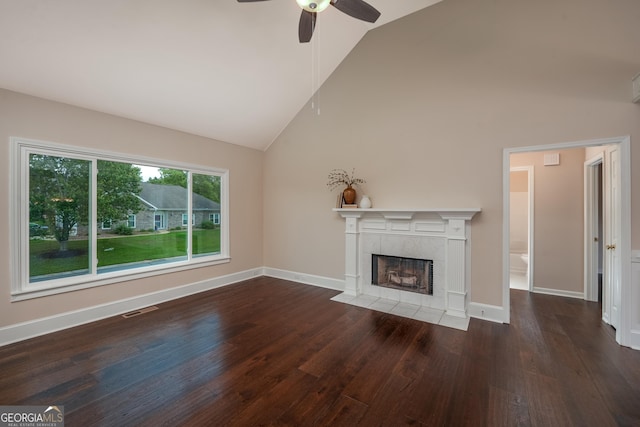 102 Peaceful Vw, Acworth, GA 30102 - unfurnished living room with a tiled fireplace, ceiling fan, wood finished floors, and high vaulted ceiling