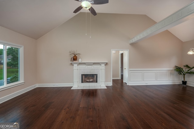 102 Peaceful Vw, Acworth, GA 30102 - unfurnished living room featuring ceiling fan, wood finished floors, a tiled fireplace, and high vaulted ceiling