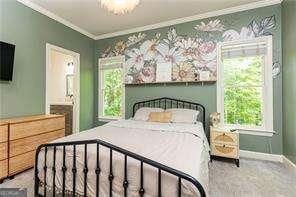 415 Morgan Falls Chase, Canton, GA 30114 - carpeted bedroom with crown molding, baseboards, a ceiling fan, and ensuite bath