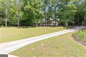 415 Morgan Falls Chase, Canton, GA 30114 - surrounding community featuring a lawn