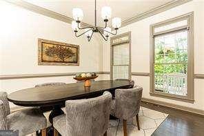 415 Morgan Falls Chase, Canton, GA 30114 - dining room featuring crown molding, a chandelier, and baseboards