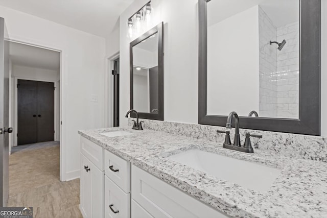 4045 White Oak Ln SW, Lilburn, GA 30047 - full bathroom featuring a tile shower and double vanity