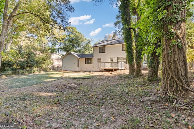 4045 White Oak Ln SW, Lilburn, GA 30047 - back of property with fence and a wooden deck