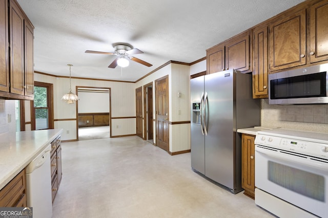 2101 Breconridge Dr SW, Marietta, GA 30064 - kitchen featuring stainless steel appliances, a ceiling fan, light countertops, crown molding, and tasteful backsplash