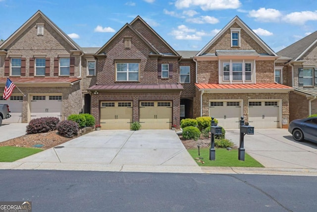 1929 Brightleaf Way, Marietta, GA 30060 - multi unit property featuring an attached garage, driveway, brick siding, and a standing seam roof