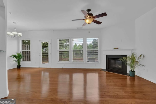 1929 Brightleaf Way, Marietta, GA 30060 - unfurnished living room featuring wood finished floors, plenty of natural light, a fireplace with flush hearth, and a ceiling fan