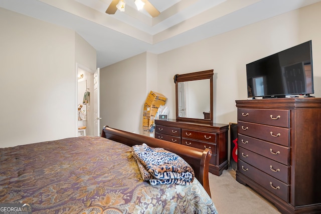 bedroom featuring light carpet and ceiling fan