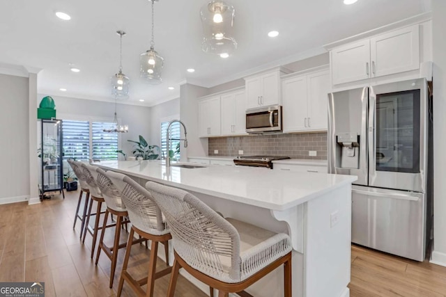 1768 Evenstad Way, Smyrna, GA 30080 - kitchen with stainless steel appliances, a sink, white cabinetry, tasteful backsplash, and a center island with sink