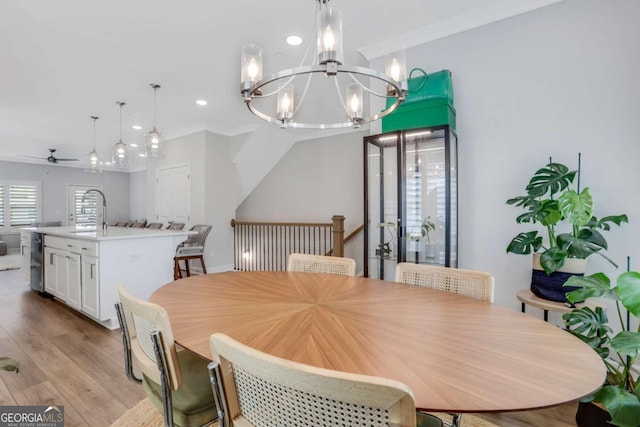 1768 Evenstad Way, Smyrna, GA 30080 - dining space with ceiling fan, a chandelier, recessed lighting, crown molding, and light wood-type flooring